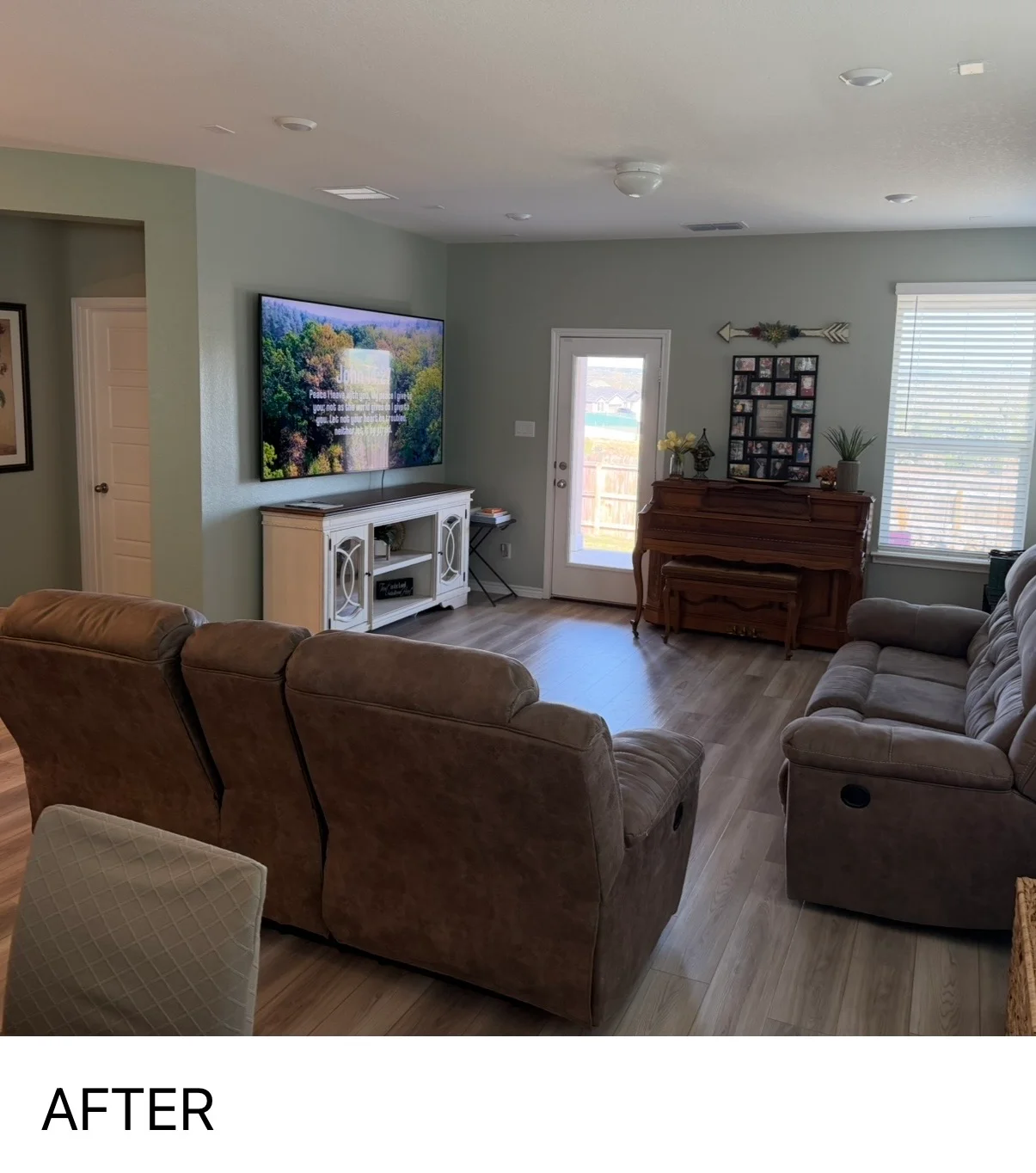 Freshly painted living room with sage green walls, white ceiling, and brown leather recliners